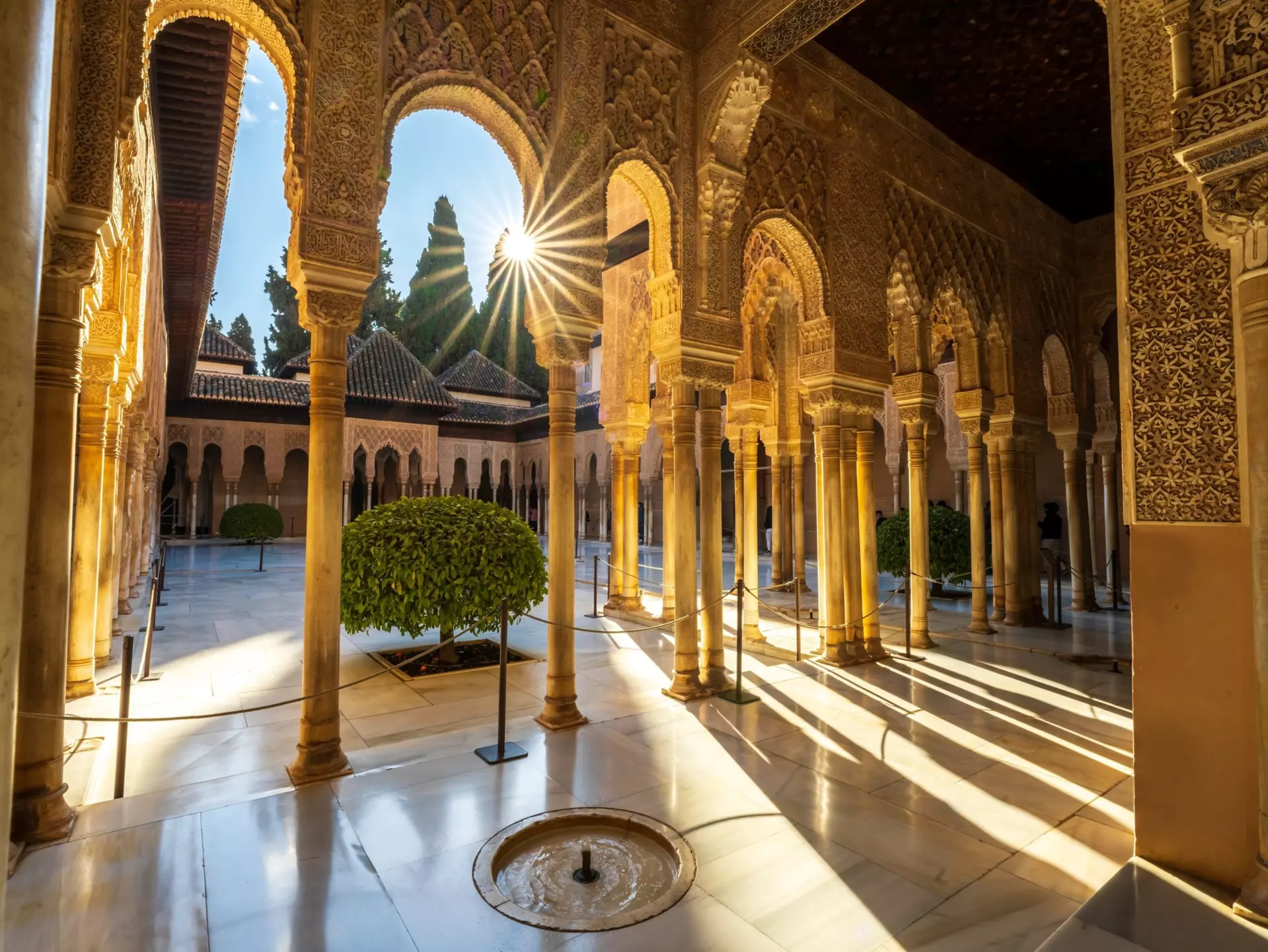 Granada, Spain, EU - March 6, 2022. Inside Alhambra Palace, interior patio courtyard, Court of the Lions with Moorish arched pillars, columns, fountain and starburst, day. A Alhambra Nasrid Palace., License Type: media, Download Time: 2024-10-03T06:33:45.000Z, User: claramonitto, Editorial: true, purchase_order: 56530, job: Global Publishing-WIP, client: Experience Andalucia 2, other: Clara Monitto