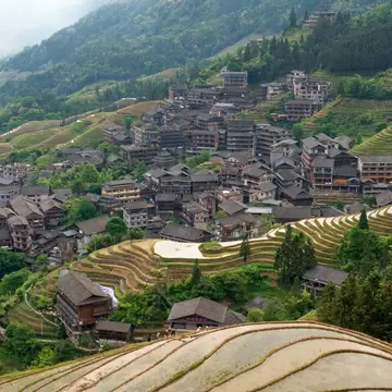 Rice Terraces and Ping'an Village from the Nine Dragons and Five Tigers Viewing Point at the Longji Rice Terraces Scenic Area on a sunny day, Longsheng County, Guilin, Guangxi Zhuang Autonomous Region, China, License Type: media, Download Time: 2026-09-02T15:50:23.000Z, User: LP_NZhan, Editorial: false, purchase_order: 65050 - Digital Destinations and Articles, job: App Content, client: Lonely Planet App, other: Nadine Zhan