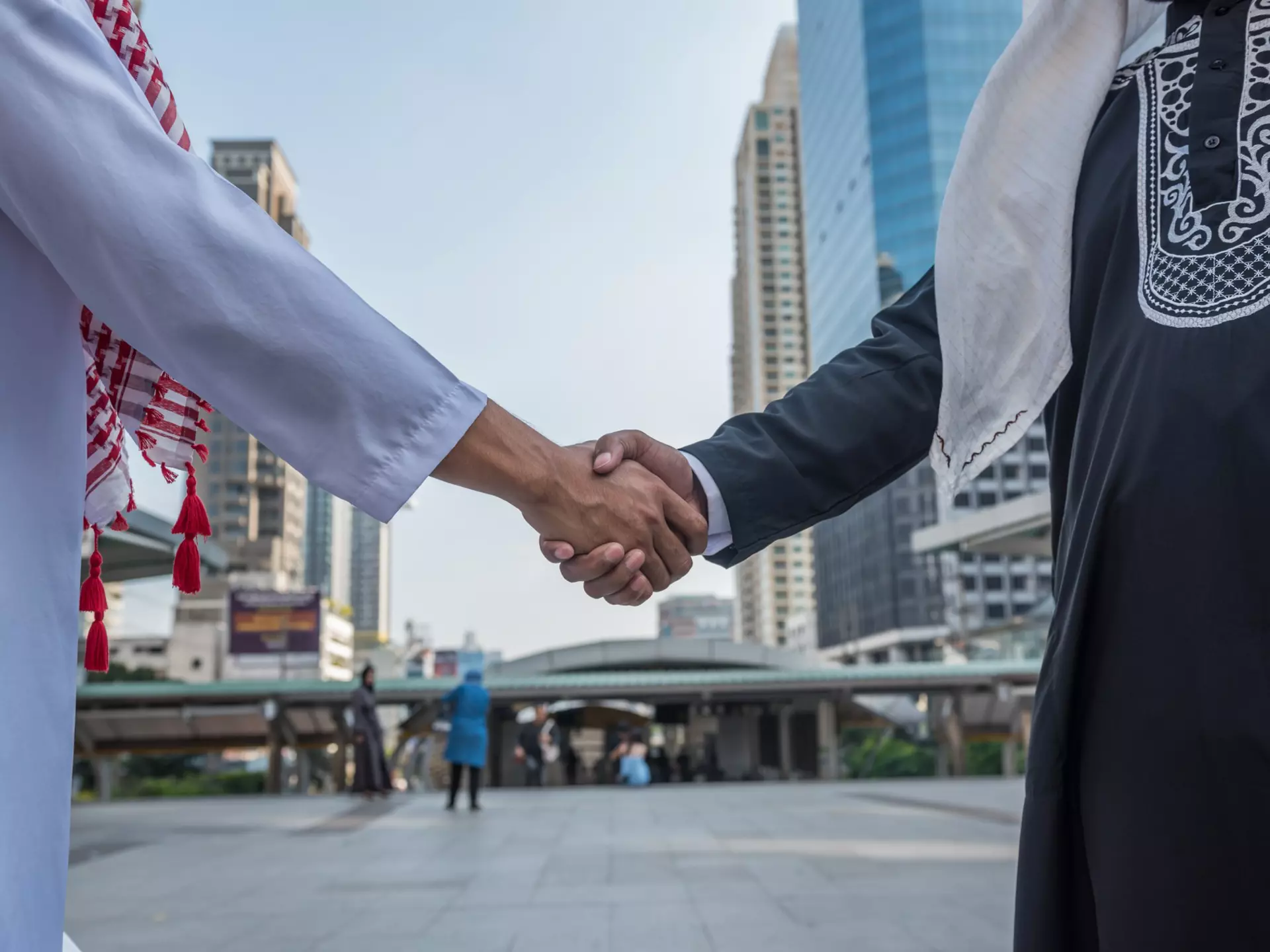 Arabian business partners shaking hands in a Saudi Arabian city.
579954454
a business teamwork, achievement, adult, advantage, agreement, arab, background, business, businessman, champion, cheerful, city, communication, competitive, cooperation, corporate, day, future, goal, greeting, group, hand, handshake, interview, job, leader, male, meeting, men, office, partners, partnership, people, professional, progress, shake, shaking hands, standing, strong, success, successful, target, team, teamwork, top, triumph, unity, win, work, worker