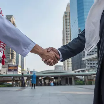 Arabian business partners shaking hands in a Saudi Arabian city.
579954454
a business teamwork, achievement, adult, advantage, agreement, arab, background, business, businessman, champion, cheerful, city, communication, competitive, cooperation, corporate, day, future, goal, greeting, group, hand, handshake, interview, job, leader, male, meeting, men, office, partners, partnership, people, professional, progress, shake, shaking hands, standing, strong, success, successful, target, team, teamwork, top, triumph, unity, win, work, worker