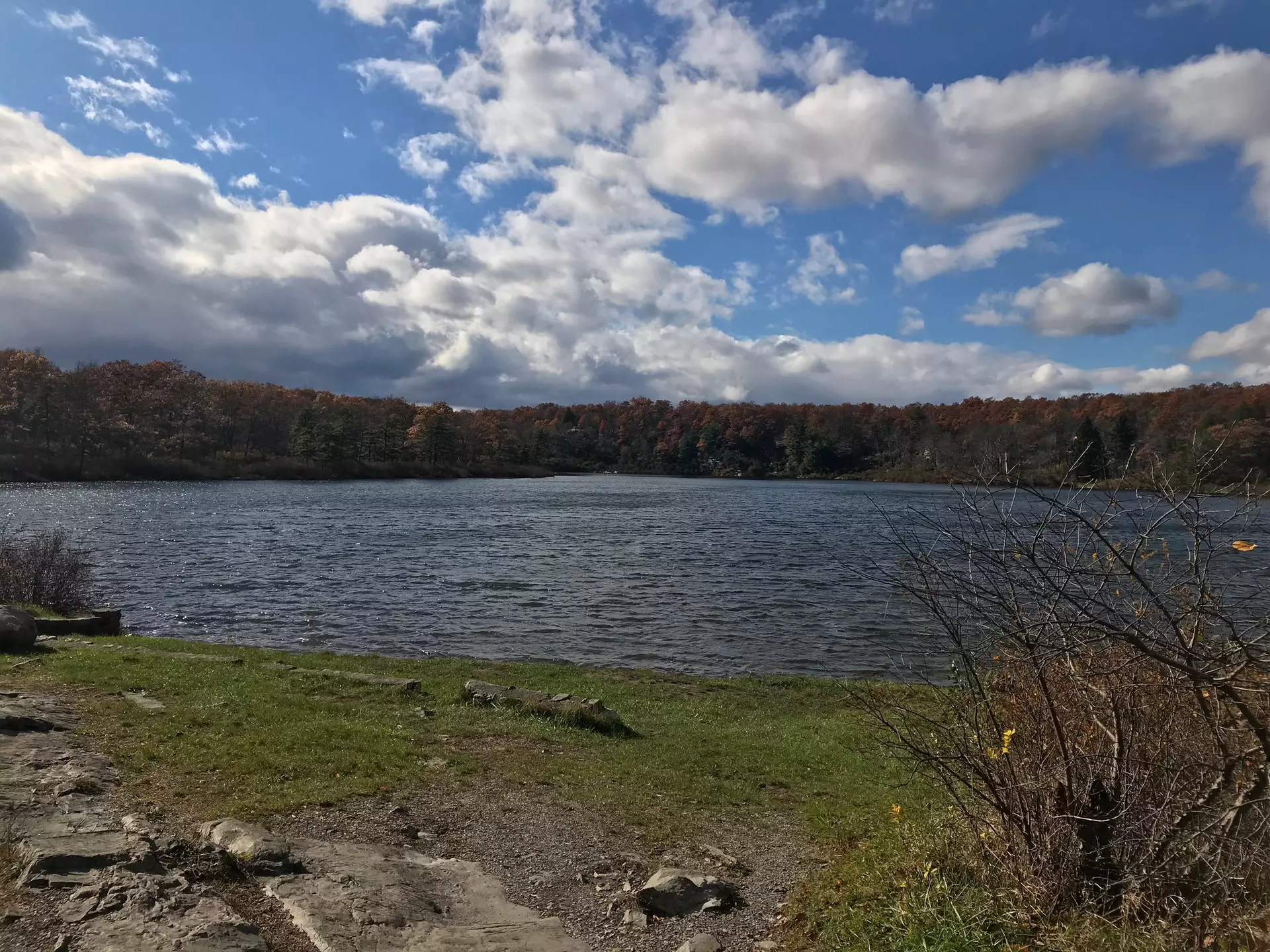 Crater Lake on the Appalachian  Trail in New Jersey Blue sky with clouds grassy shoreline with rocks and shrubs  License Type: media  Download Time: 2021-09-22T16:59:05.000Z  User: Malecia.Elamin_Lonelyplanet  Is Editorial: No  purchase_order: