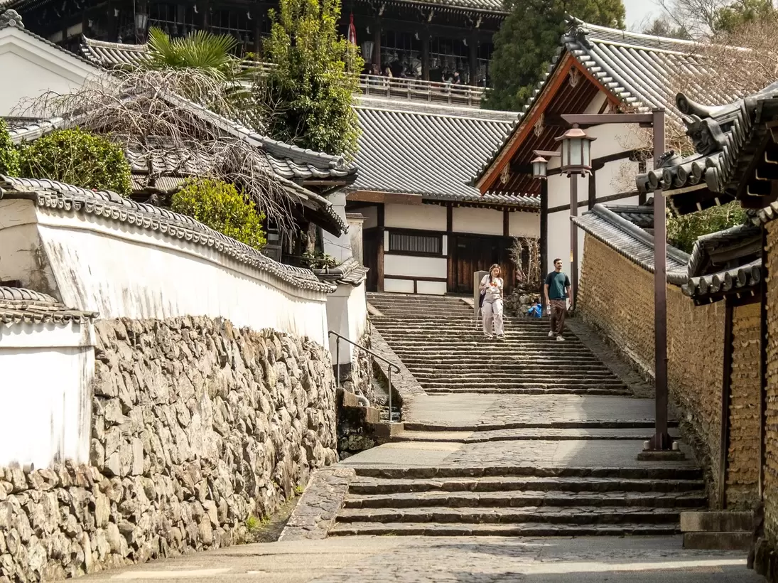 Nara, Japan - March 25, 2025: visitors walking down historic street from Nigatsu-do Hall at Todai-ji Temple., License Type: media, Download Time: 2026-06-02T20:23:09.000Z, User: LP_NZhan, Editorial: true, purchase_order: 65050 - Digital Destinations and Articles, job: App content, client: Lonely Planet App, other: Nadine Zhan 