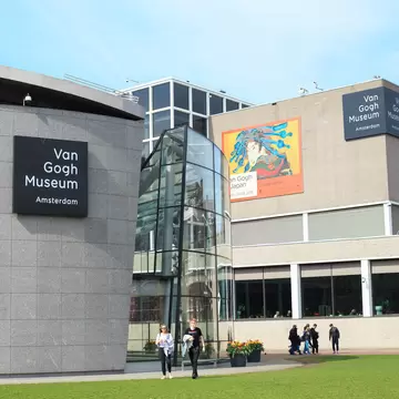 Exterior view of the Van Gogh Museum on a sunny day in Amsterdam.