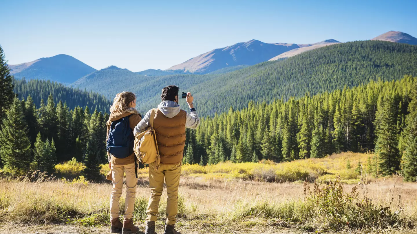 A couple hiking in mountain scenery near Breckenridge, Colorado