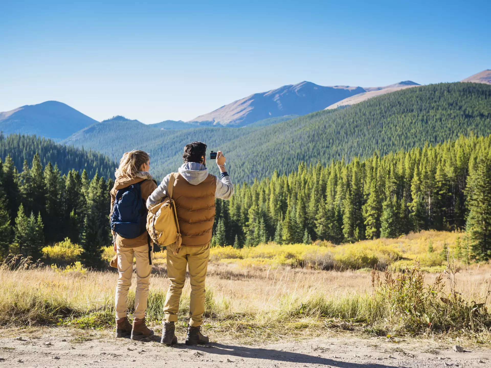 A couple hiking in mountain scenery near Breckenridge, Colorado