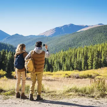 A couple hiking in mountain scenery near Breckenridge, Colorado
