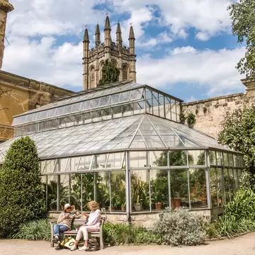 Oxford, UK - June2, 2021: Red poppies in Oxford Botanic garden (founded 1621),  and Magdalen college tower. Oxford University, License Type: media, Download Time: 2026-04-23T17:47:50.000Z, User: LP_ZRay, Editorial: true, purchase_order: 65050 - Digital Destinations and Articles, job: Lonely Planet, client: App Content, other: Zayira Ray