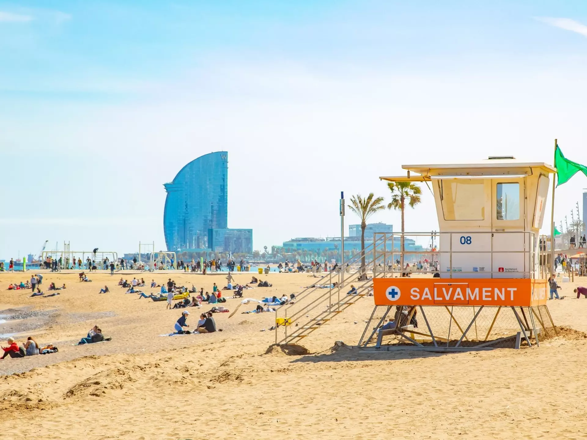 View of the lifeguard tower on Barceloneta beach on a sunny day in Barcelona, Spain.
