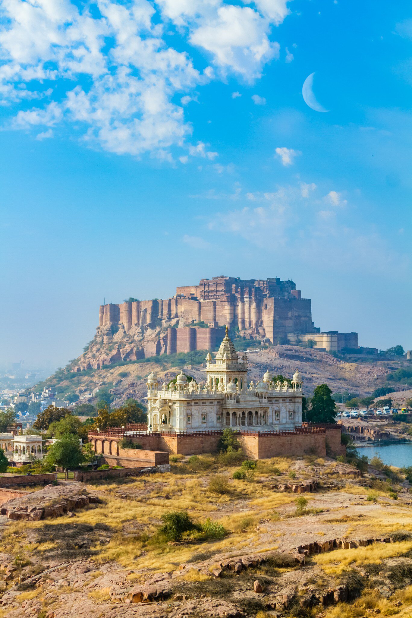 A cresecent moon over Jaswant Thada memorial and the Mehrangarh Fort in Jodhpur, India.