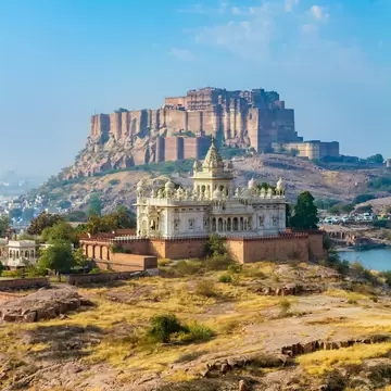 A cresecent moon over Jaswant Thada memorial and the Mehrangarh Fort in Jodhpur, India.