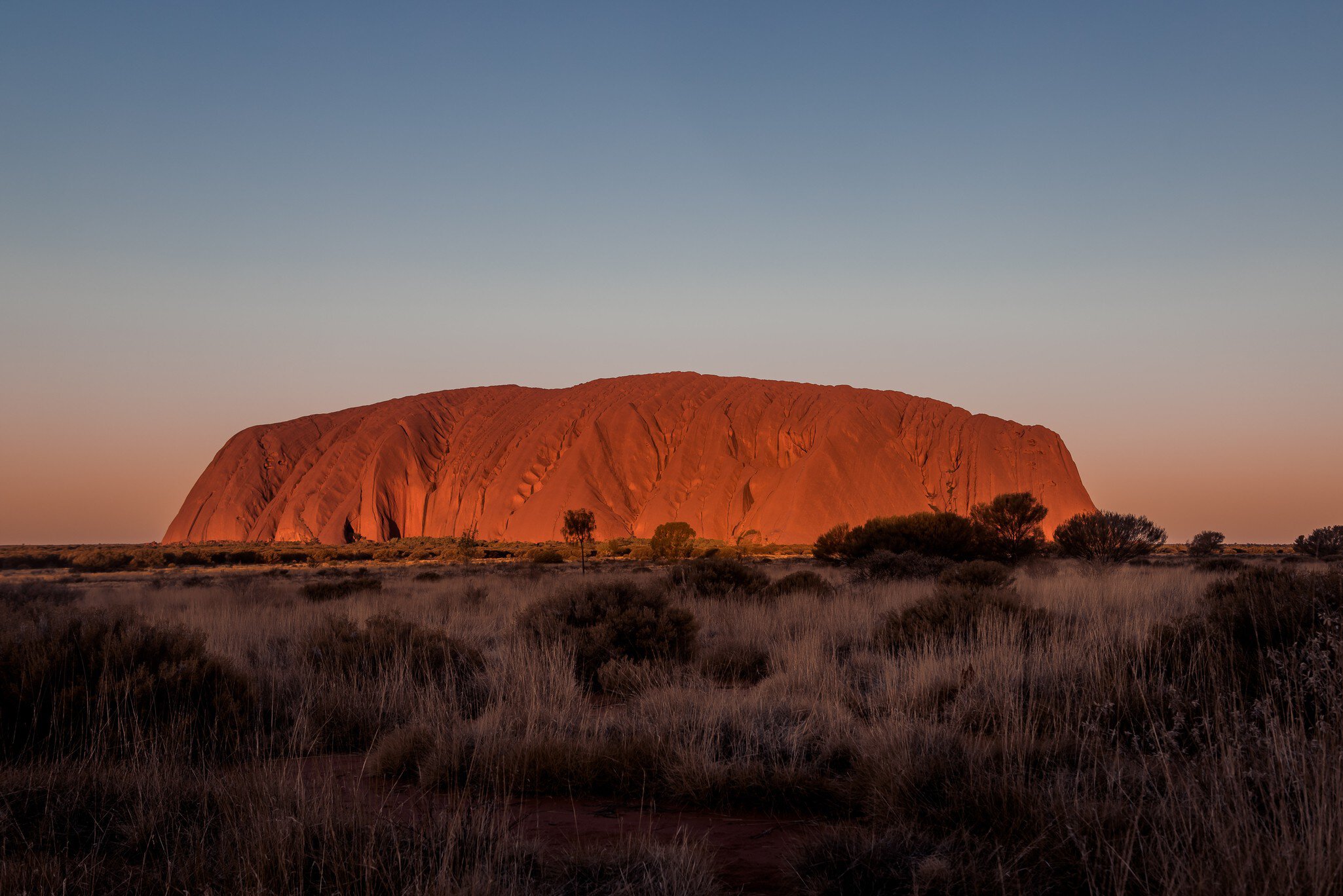 View of Uluṟu at sunset in Australia.