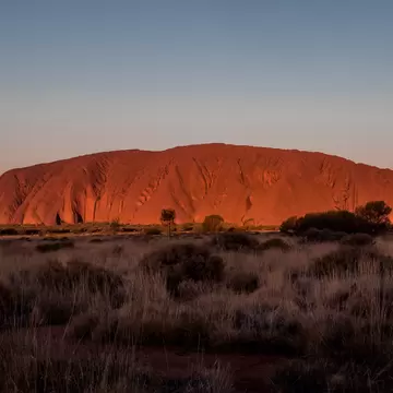 View of Uluṟu at sunset in Australia.