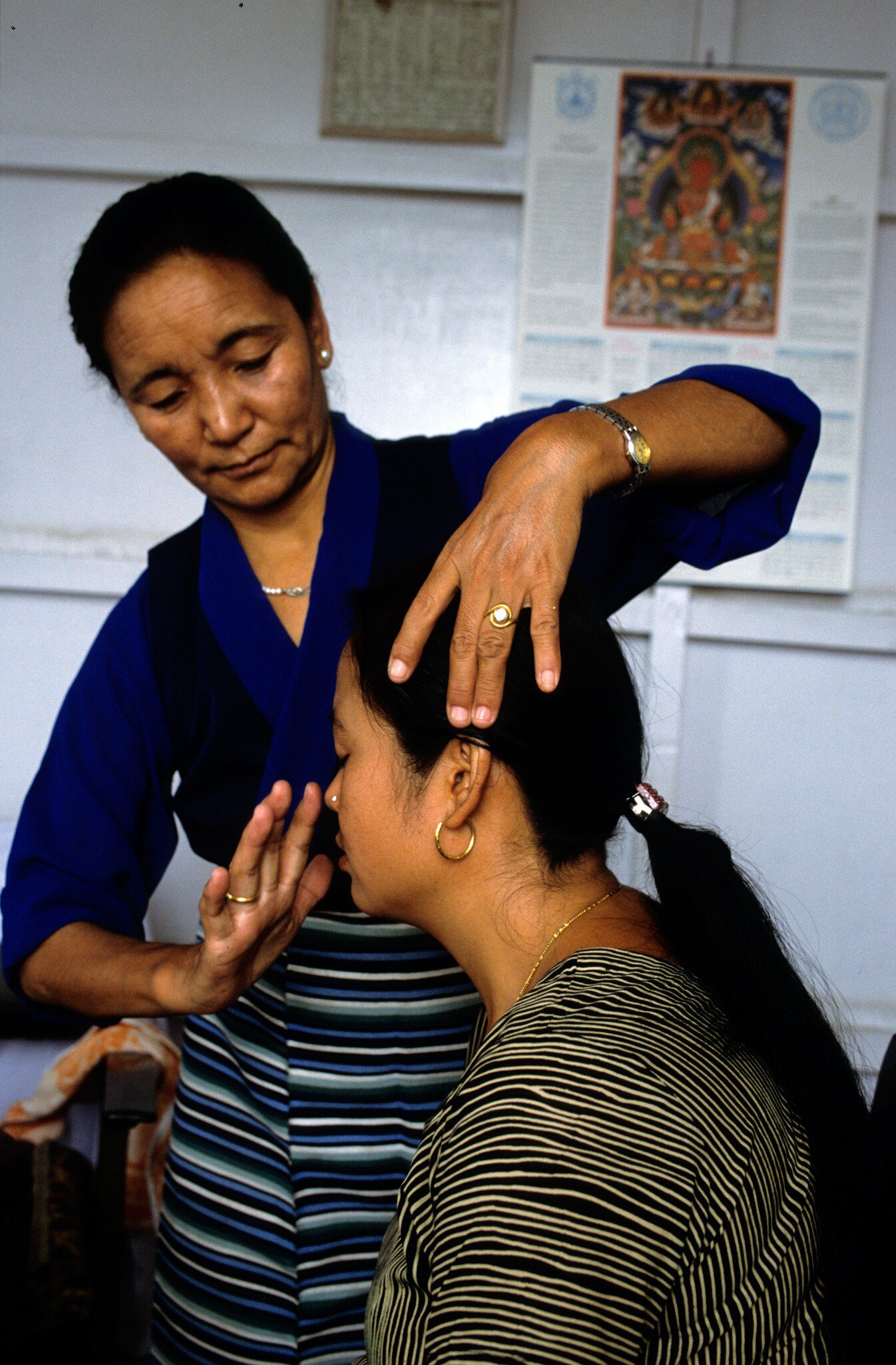 AHXFF9 Amchi Tibetan medicine doctor diagnosing patient in Men Tse khang Tibetan Medical Astro Institute Branch Clinic Boudhanath.
AHXFF9
Amchi, Tibetan, medicine, Men, Tse, khang, Boudhanath, traditional, medicine, diagnosis, healthcare, alternative, medicine, Nepal, Tibetan, Medical, Astro, Institute, Amchi, Tibetan, medicine, doctor, patient, Men, Tse, khang, Tibetan, Medical, Astro, Institute, Boudhanath, Nepal, diagnosis, traditional, medicine, healing, healthcare, alternative, medicine, holistic, wellness, treatment, examination, medical, clinic, practitioner, culture, heritage, Asian, medicine, woman, doctor, female, patient, therapy, spiritual, healing, ancient, wisdom, pulse, diagnosis, touching, head, forehead, concentration, care, compassion, professional, ethnic, traditional, dress, striped, shirt, long, hair, jewelry, watch, ring, poster, Buddhist, art, clinic, interior, health, service, medical, consultation, diagnostic, natural, medicine, Kathmandu
**RIGHTS MANAGED**