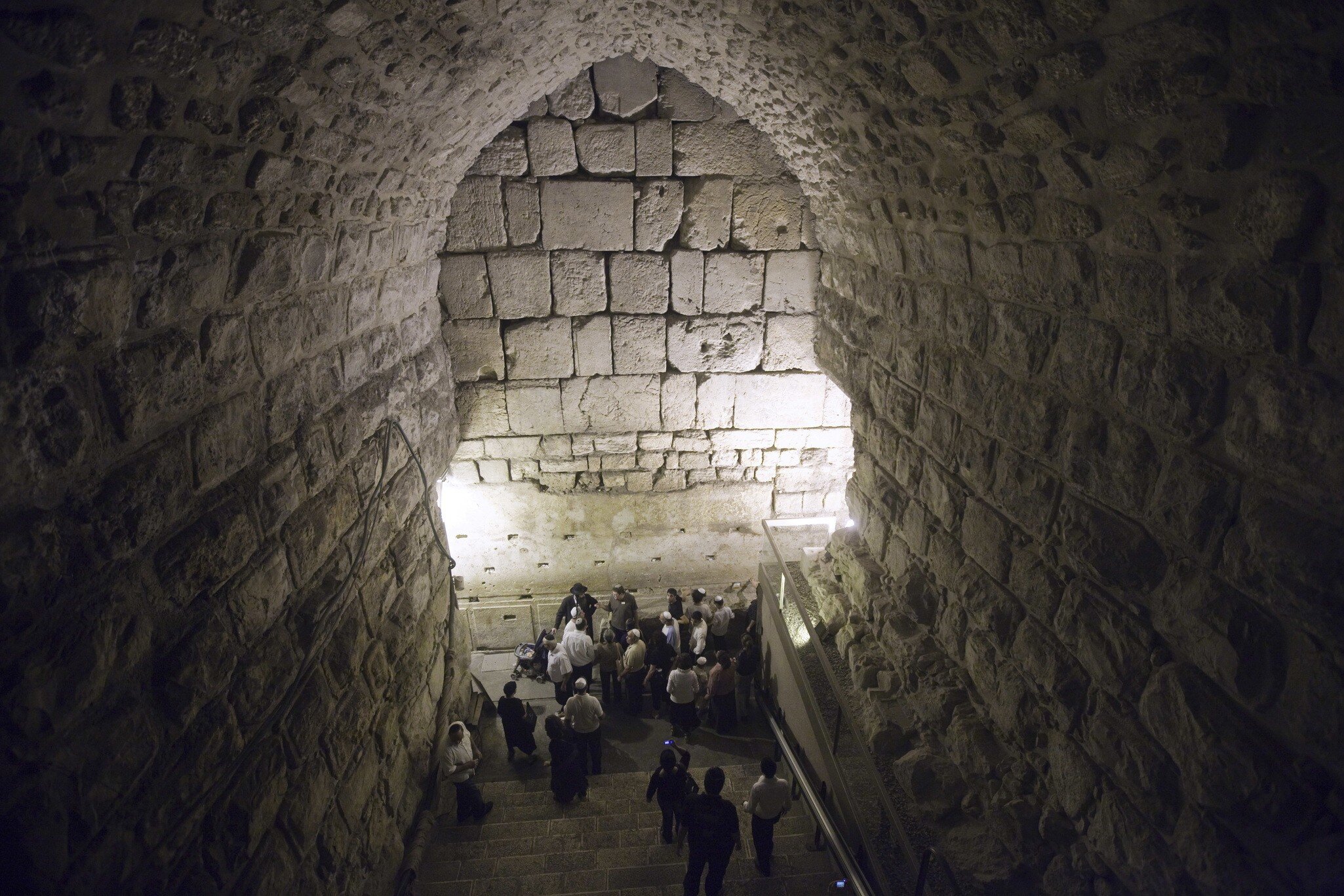 Tourists visit the site of excavations in the Western Wall tunnels, on October 22, 2009 in Jerusalem?s old city, during a tour organized by the Israeli Government Press Office to deny claims that the Israeli Antiquity Authority is conducting excav...
