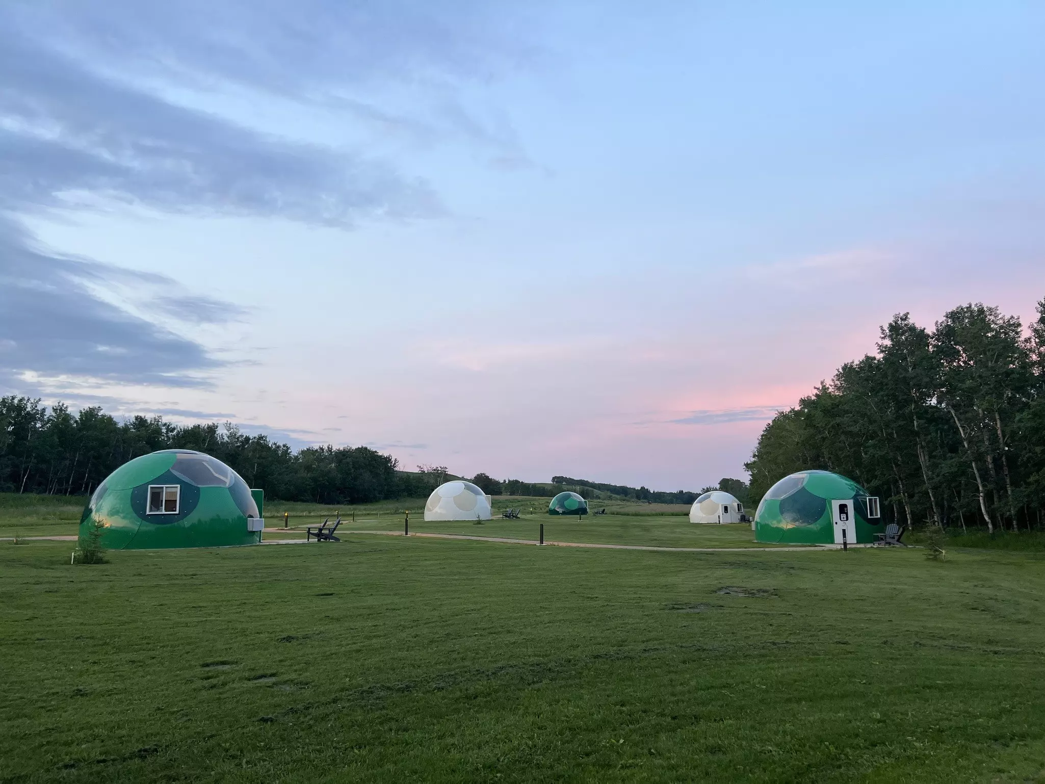 A field with several domes in it that are perfect for stargazing
