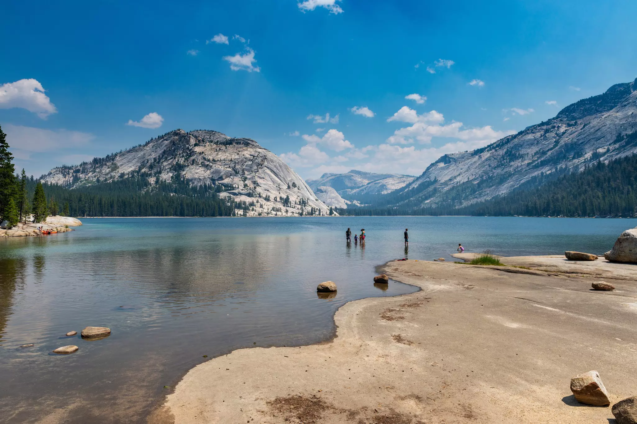 People bathing at the Tenaya Lake, in the Yosemite National Park, California, USA.