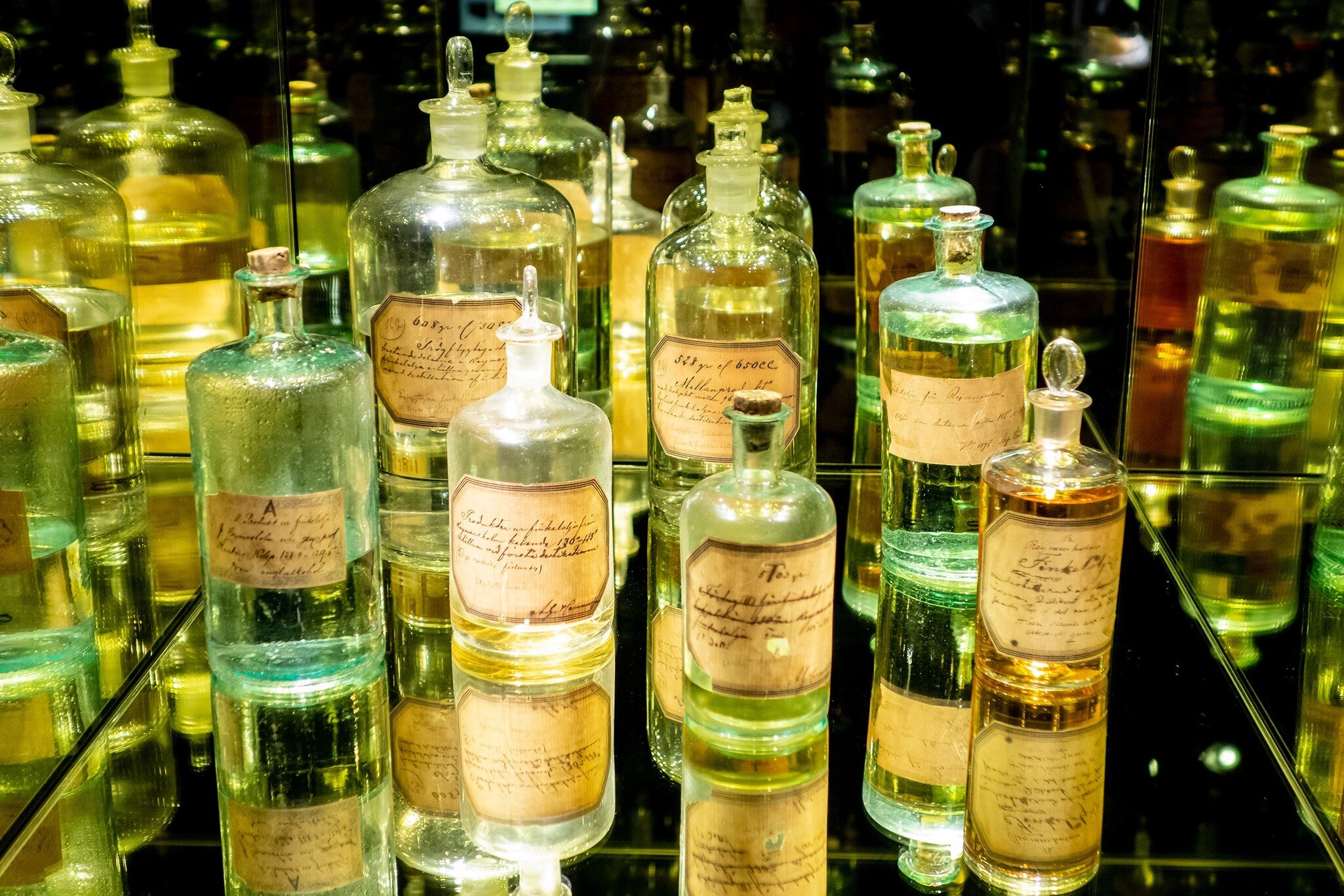 STOCKHOLM, SWEDEN - APRIL 19, 2019: The antique spirit bottles at Spritmuseum in Stockholm, Sweden, where history of alcoholic beverages is presented; Shutterstock ID 2021021498;