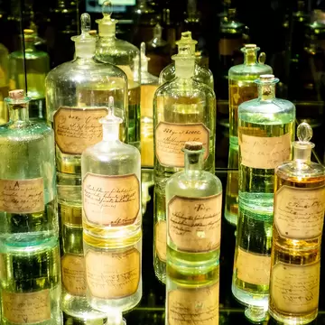 STOCKHOLM, SWEDEN - APRIL 19, 2019: The antique spirit bottles at Spritmuseum in Stockholm, Sweden, where history of alcoholic beverages is presented; Shutterstock ID 2021021498;