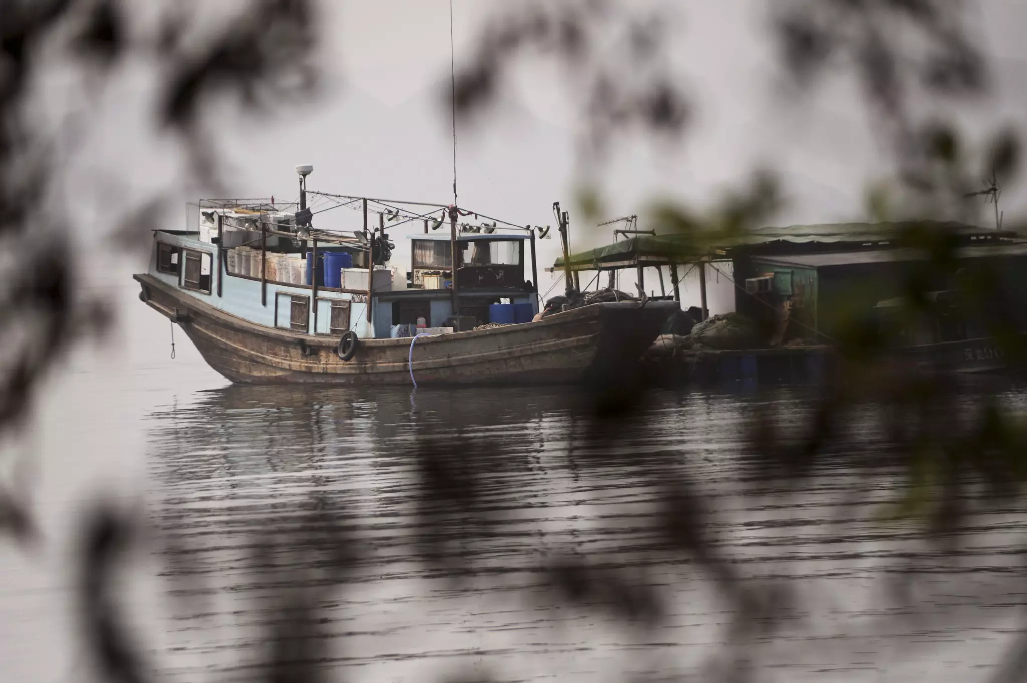 A traditional fishing boat moored in the harbor of Kat O Island