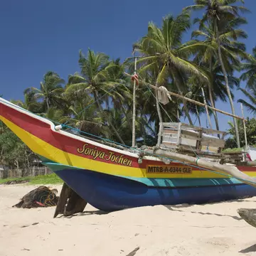 Outrigger on Hikkaduwa Beach,  Sri Lanka