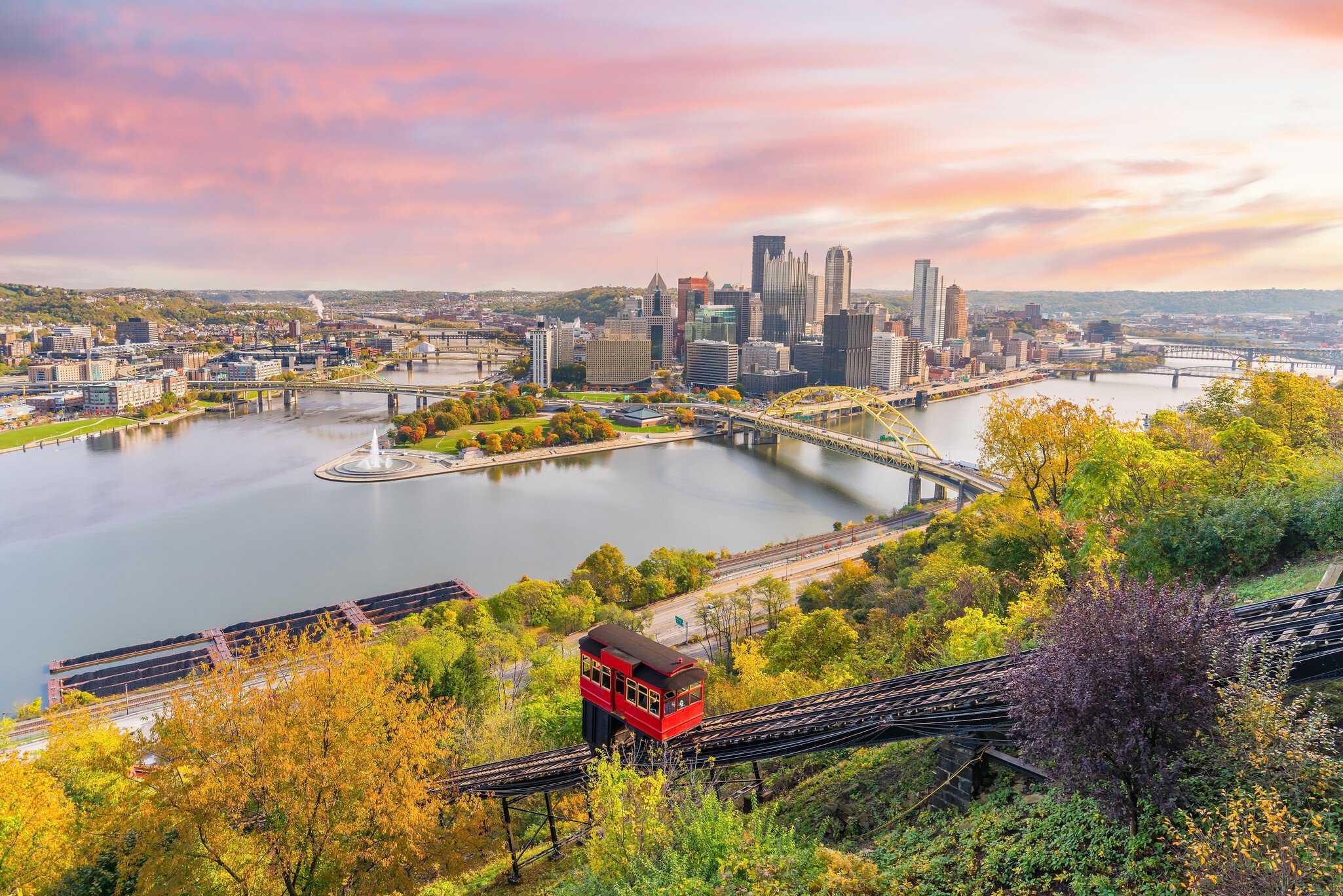 Cityscape of downtown skyline and vintage incline in Pittsburgh, Pennsylvania, USA at sunset