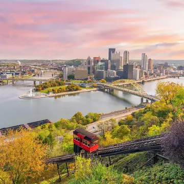 Cityscape of downtown skyline and vintage incline in Pittsburgh, Pennsylvania, USA at sunset