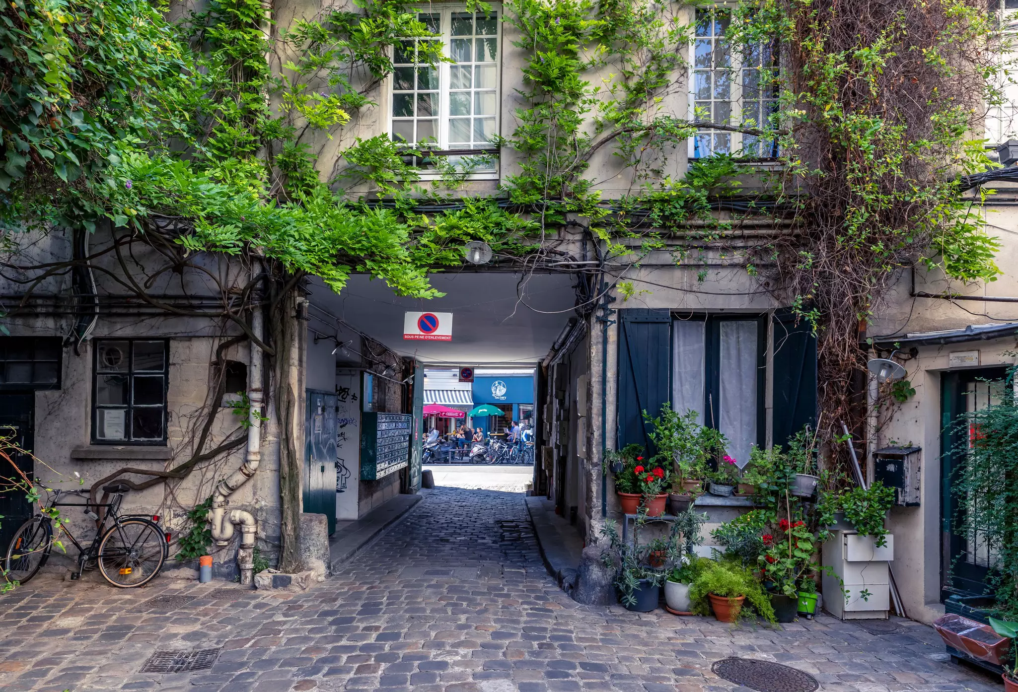 An aerial view of a child on a brightly coloured bicycle