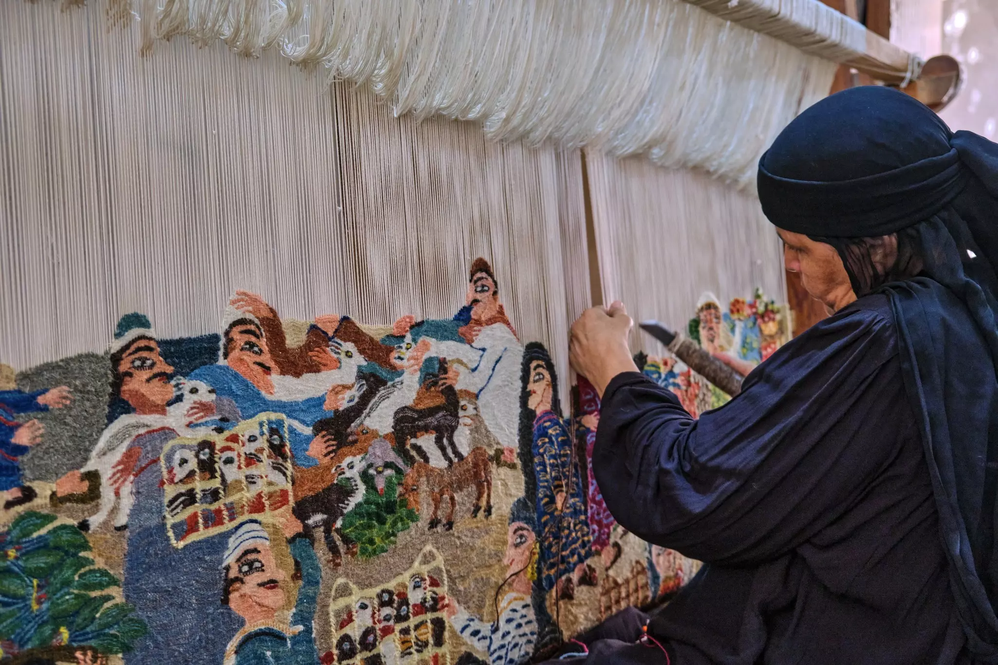 A woman weaving at the Ramses Wissa Wassef Art Center, Giza, Egypt.