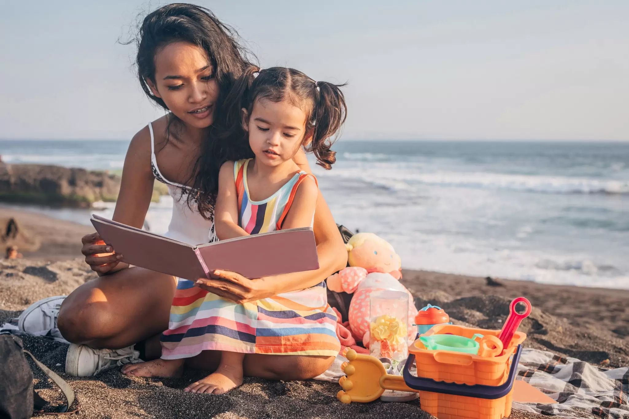 A mother and daughter on the beach