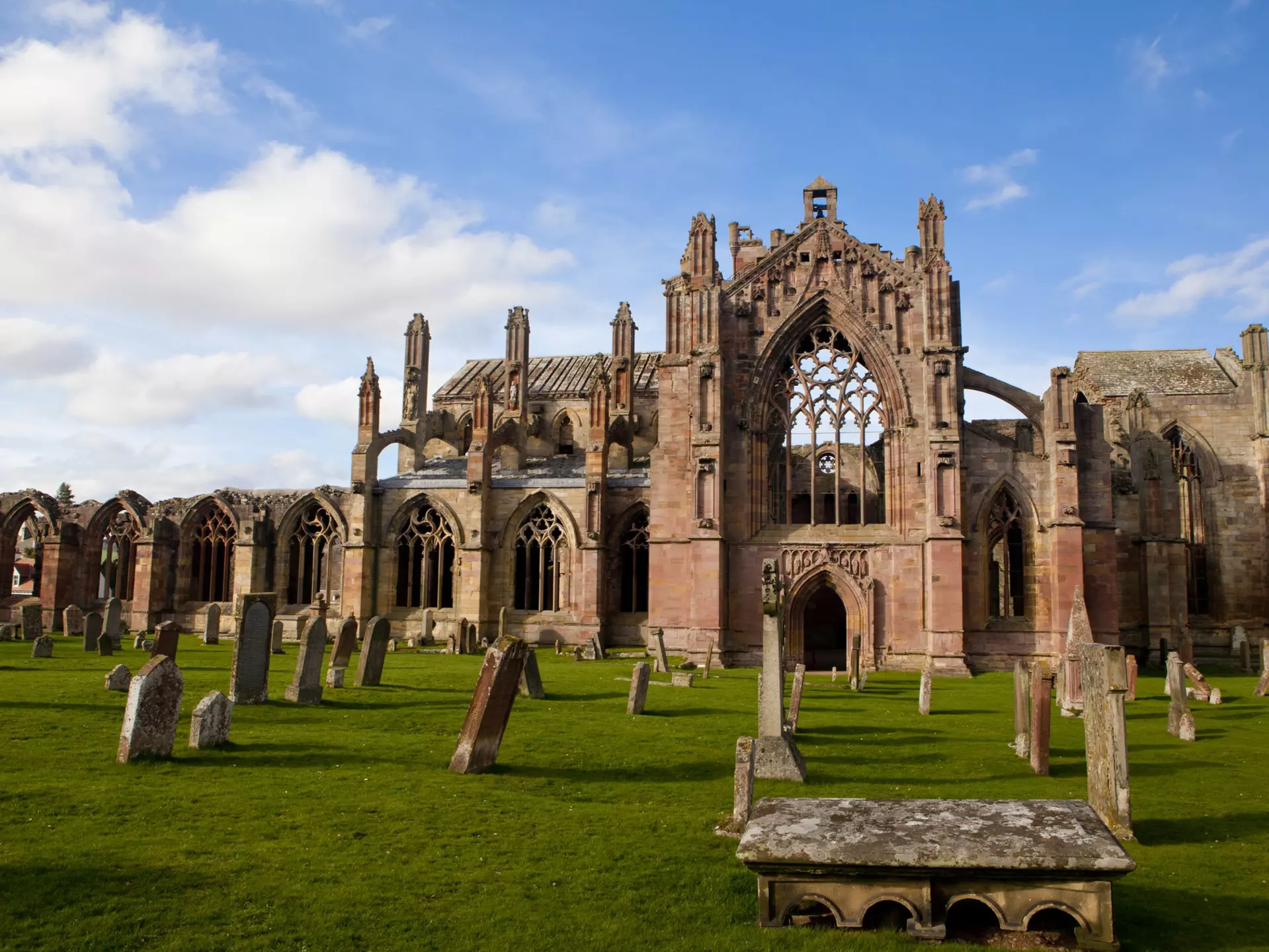 The ruins of Melrose Abbey on a bright sunny day, Melrose, Scotland, United Kingdom