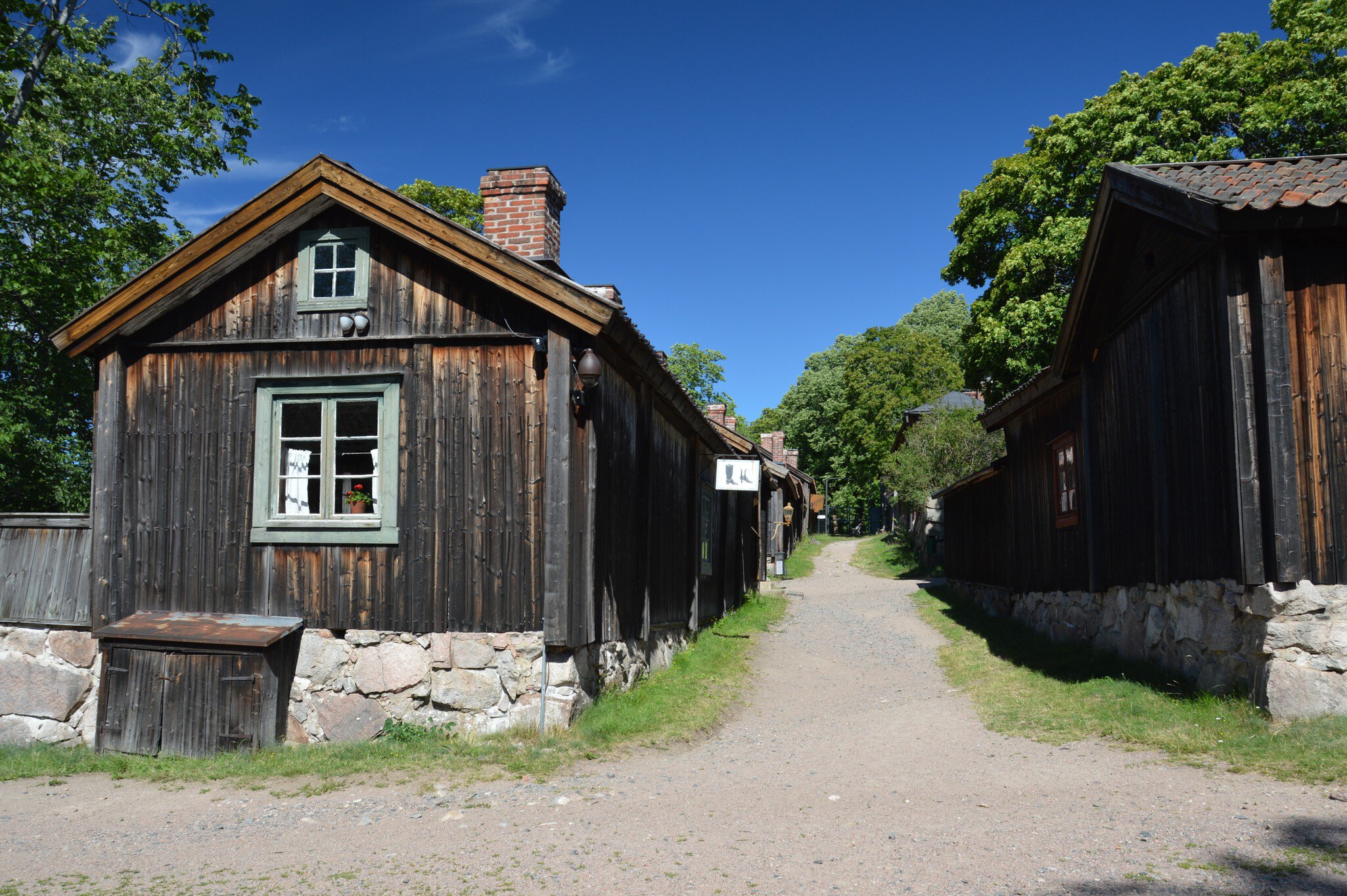 Turku, Finland - July, 2020: Beautiful old homes and artisan quarters in Luostarinmaki open air museum. This is the only wooden neighbourhood that survived the Great Fire of Turku in 1827.; Shutterstock ID 1784353256;