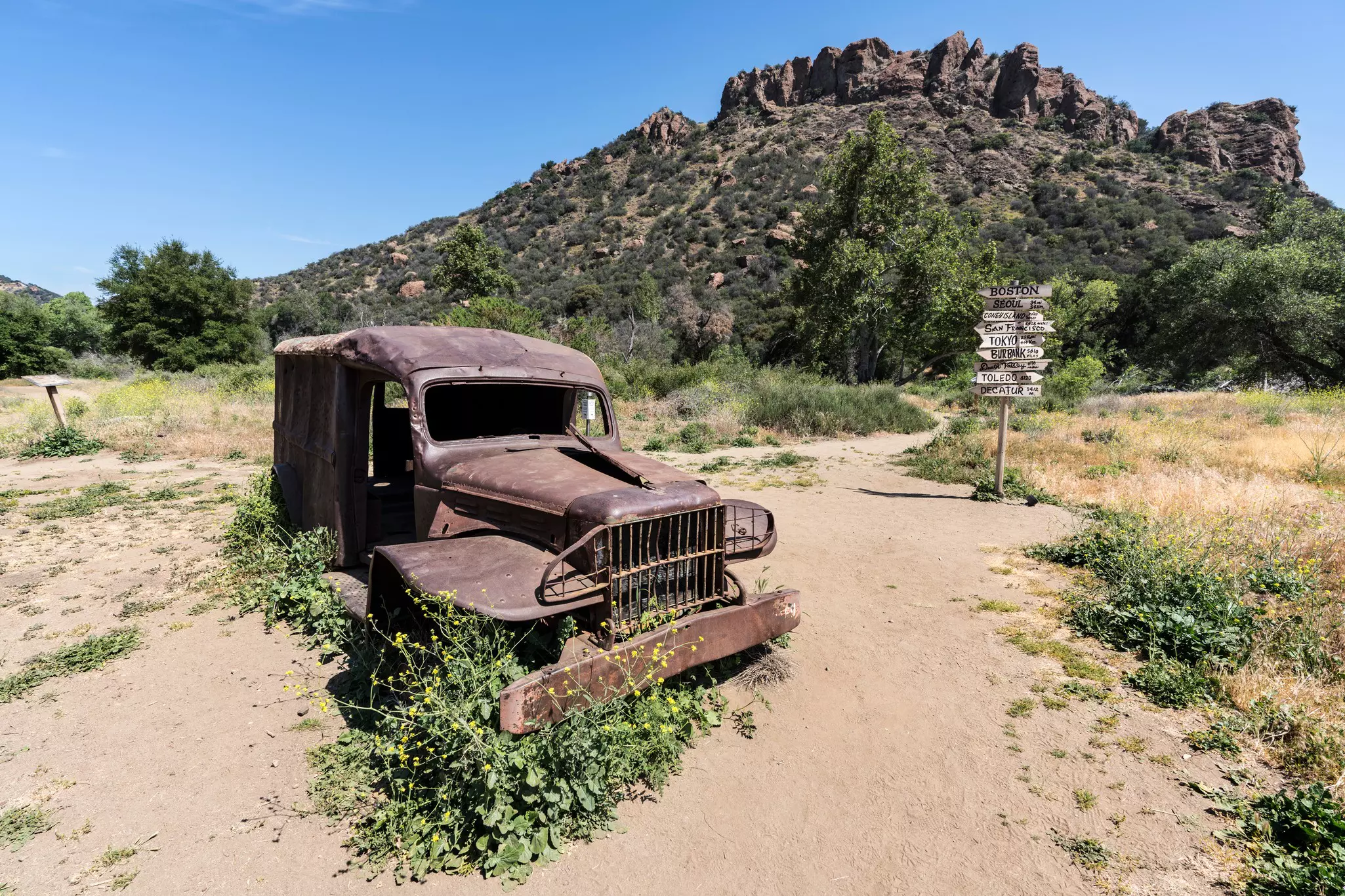 Malibu, California, USA - May 29, 2018:  Old "MASH" television show ruined vehicle and prop sign on display at Malibu Creek State Park.  License Type: media  Download Time: 2021-10-20T16:51:48.000Z  User: Malecia.Elamin_Lonelyplanet  Is Editorial: Yes  purchase_order:   