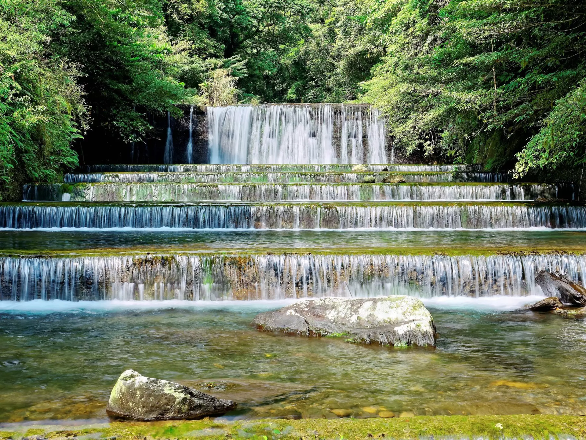 Series of small waterfalls in the Forest Recreation Area of Wulai during spring.