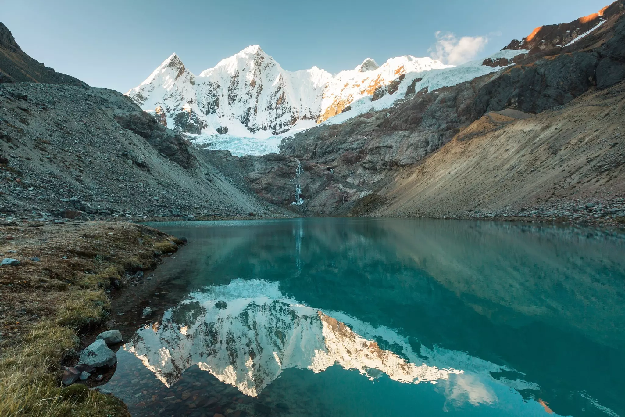 Snowy peaks reflected in a lake in the Cordillera Blanca, Peru. 