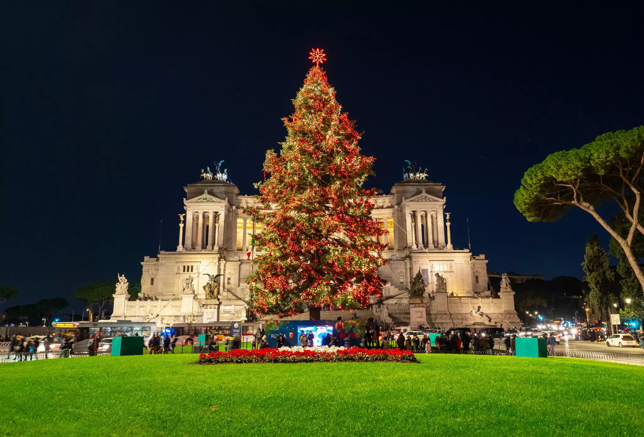 Piazza Venezia square during the Christmas holiday, with lights, decorations and a Christmas tree named Spelacchio