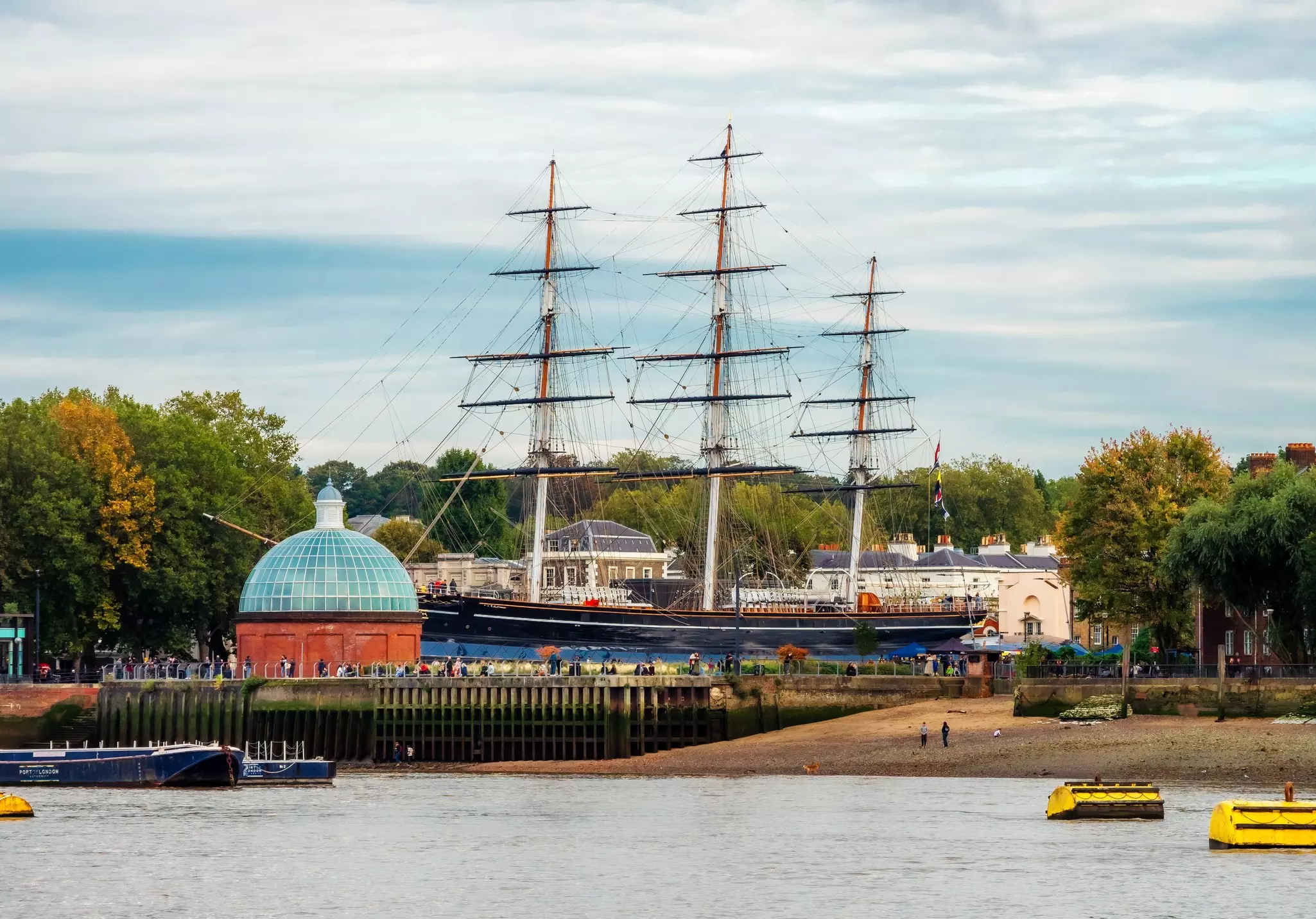 London, England, UK - October 17, 2019: View from the River Thames of the famous Cutty Sark historical ship and Greenwich Pier in fall season, License Type: media, Download Time: 2024-12-18T22:12:45.000Z, User: meg3348277, Editorial: true, purchase_order: 56530 - Guidebooks, job: Global Publishing-WIP, client: England 13, other: Megan Cassidy