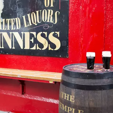 Dublin, Ireland - May 31, 2013: Pints of Guinness beer sit on a barrel outside Temple Bar, established in 1840 and located in the Temple Bar district of Dublin.
478999387
Guinness, Pub, Temple Bar, Building Exterior, No People, Stout, Facade, Color Image, Glass, Drinking, Relaxation, Red, Irish Culture, Famous Place, Pint Glass, Horizontal, Dublin - Ireland, County Dublin, Republic of Ireland, Northern Europe, Western Europe, Europe, Bar, Beer, Alcohol