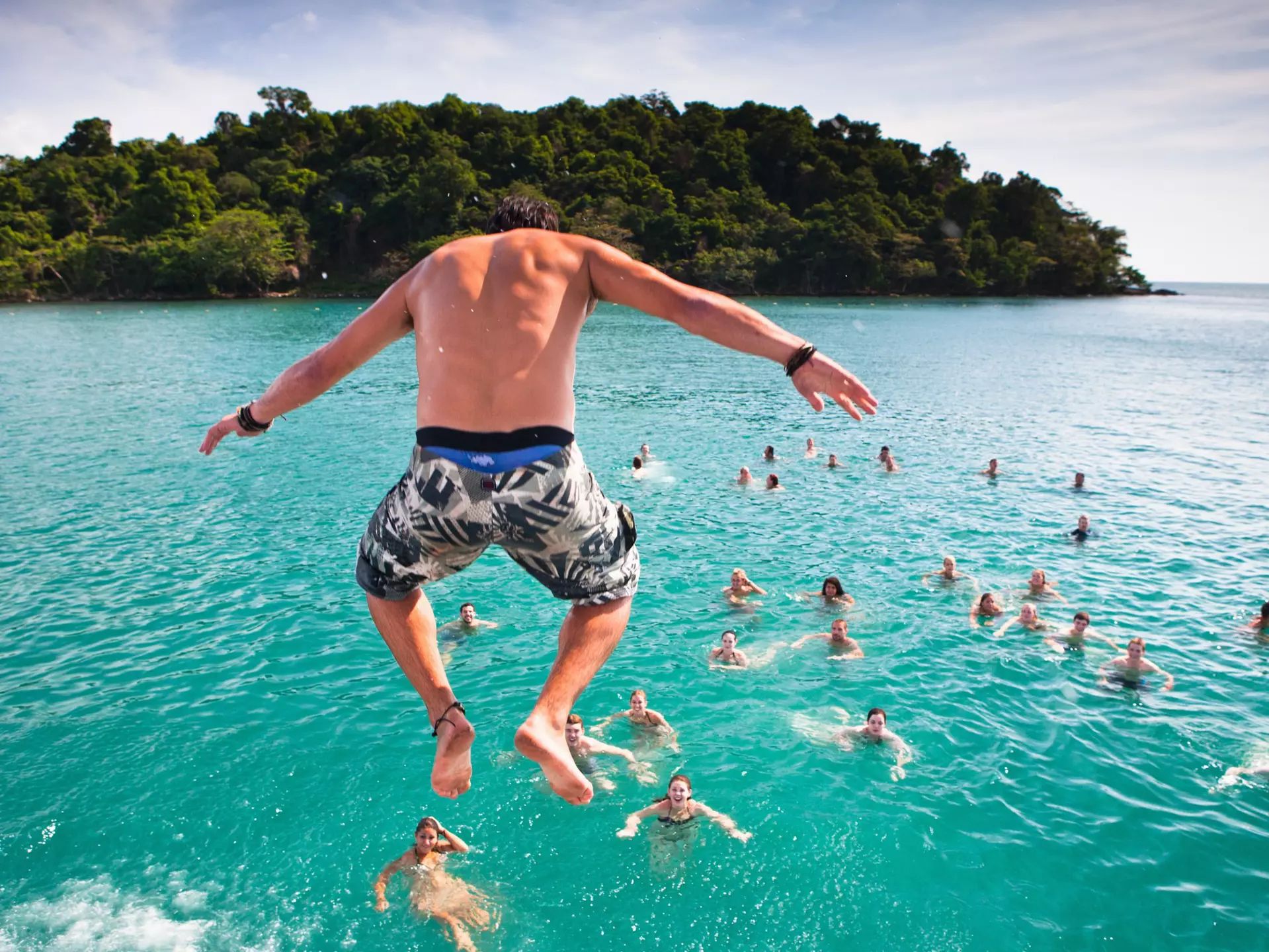 A popular activity in Sihanoukville, Cambodia is the Dolphin Shack booze cruise which takes backpackers out to swim and party at various islands
150961342
Jumping into ocean, ocean, swimming, Cambodia, Partying
