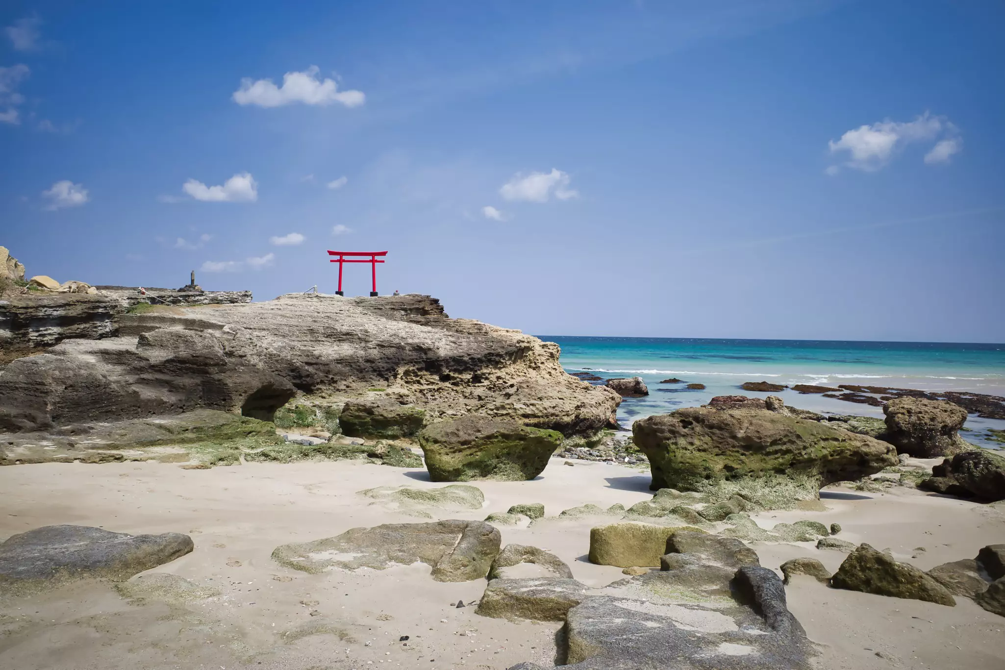 Blue sea and red torii of Shirahama coast in Shimoda, Izu.