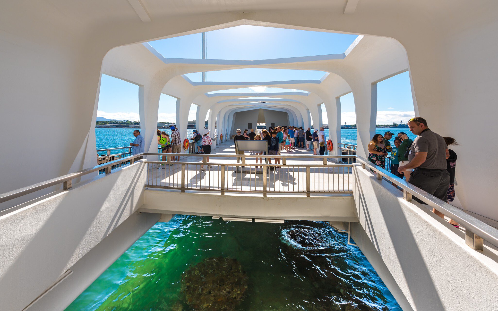 Pearl Harbor, Hawaii, USA - January 8, 2017: Accessible only by boat, the USS Arizona Memorial straddles the sunken hull of the battleship without touching it. ; Shutterstock ID 1252026778;