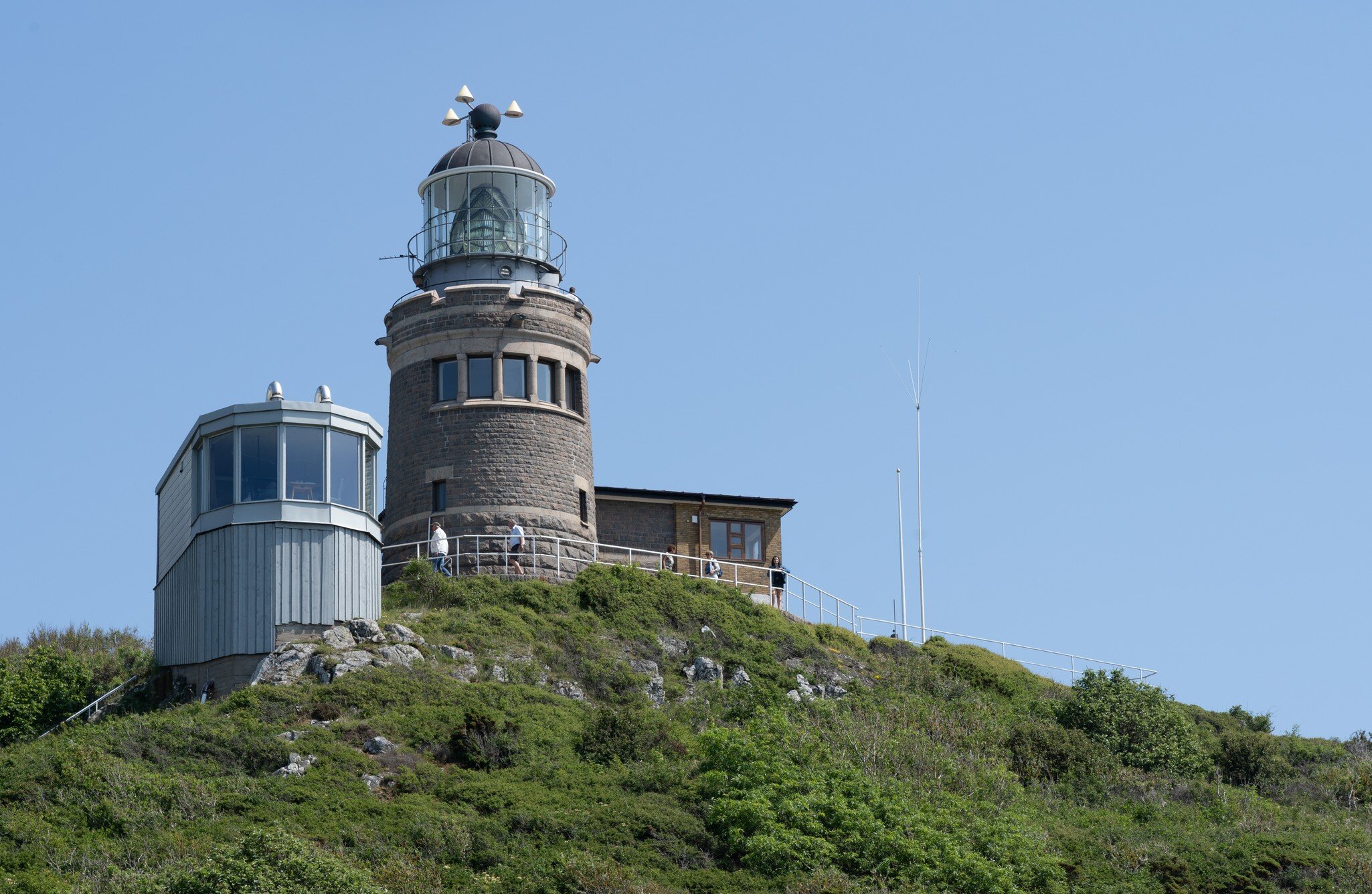 MOLLE, SWEDEN - JUNE 13, 2020: The Kullen Lighthouse on a summer day with clear blue sky at Kullaberg Nature Reserve in South Sweden.; Shutterstock ID 1755474824;