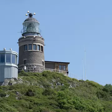 MOLLE, SWEDEN - JUNE 13, 2020: The Kullen Lighthouse on a summer day with clear blue sky at Kullaberg Nature Reserve in South Sweden.; Shutterstock ID 1755474824;