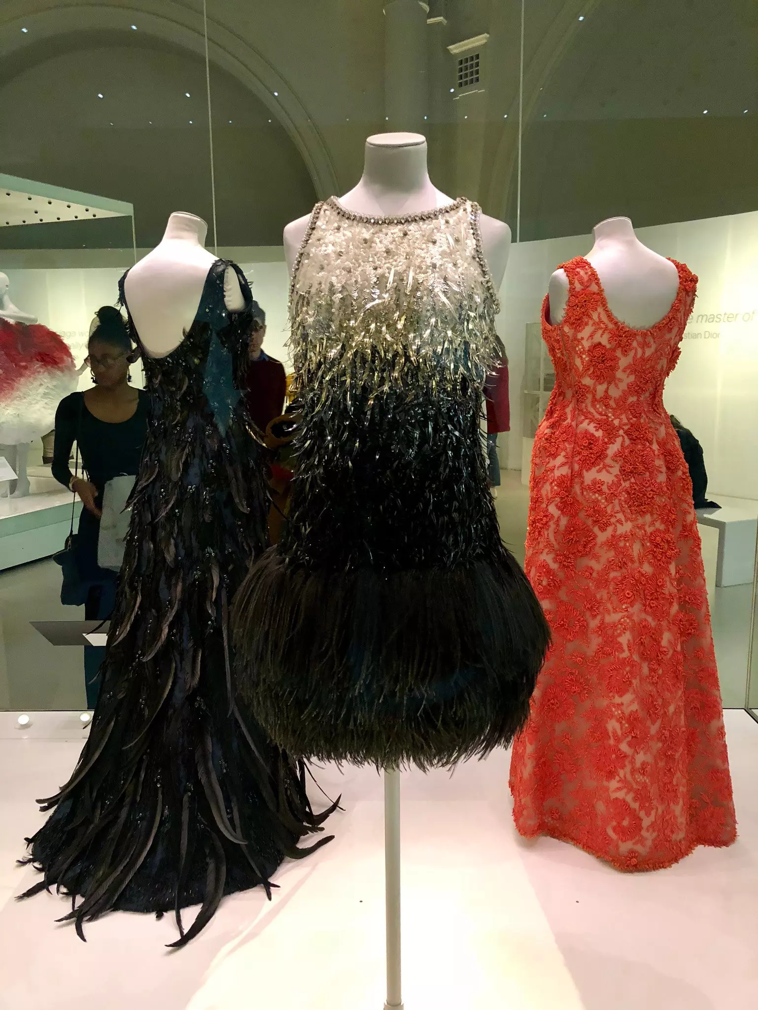 Evening dresses designed by Yves Saint Laurent on display at the Balenciaga exhibition at the Victoria & Albert Museum in South Kensington, London, England.