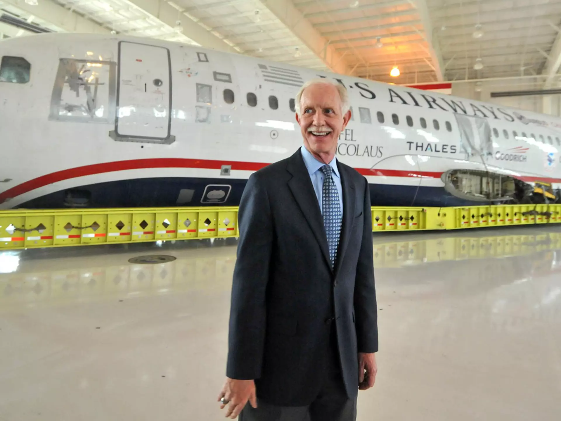 Capt. Chesley "Sully" Sullenberger in front of US Airways aircraft he landed in the Hudson River.