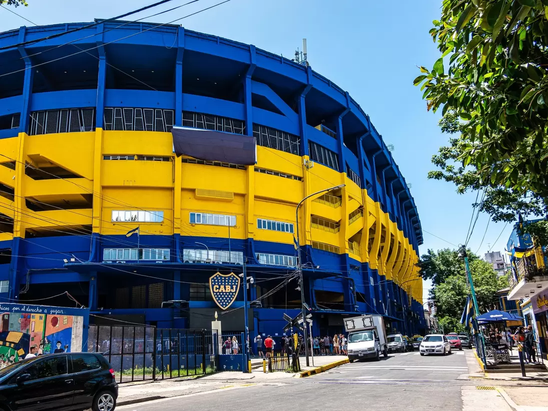 Exterior of Museo de la Pasión Boquense and La Bombonera soccer stadium, large blue and yellow facade. Boca Juniors in La Boca, Buenos Aires in Argentina.