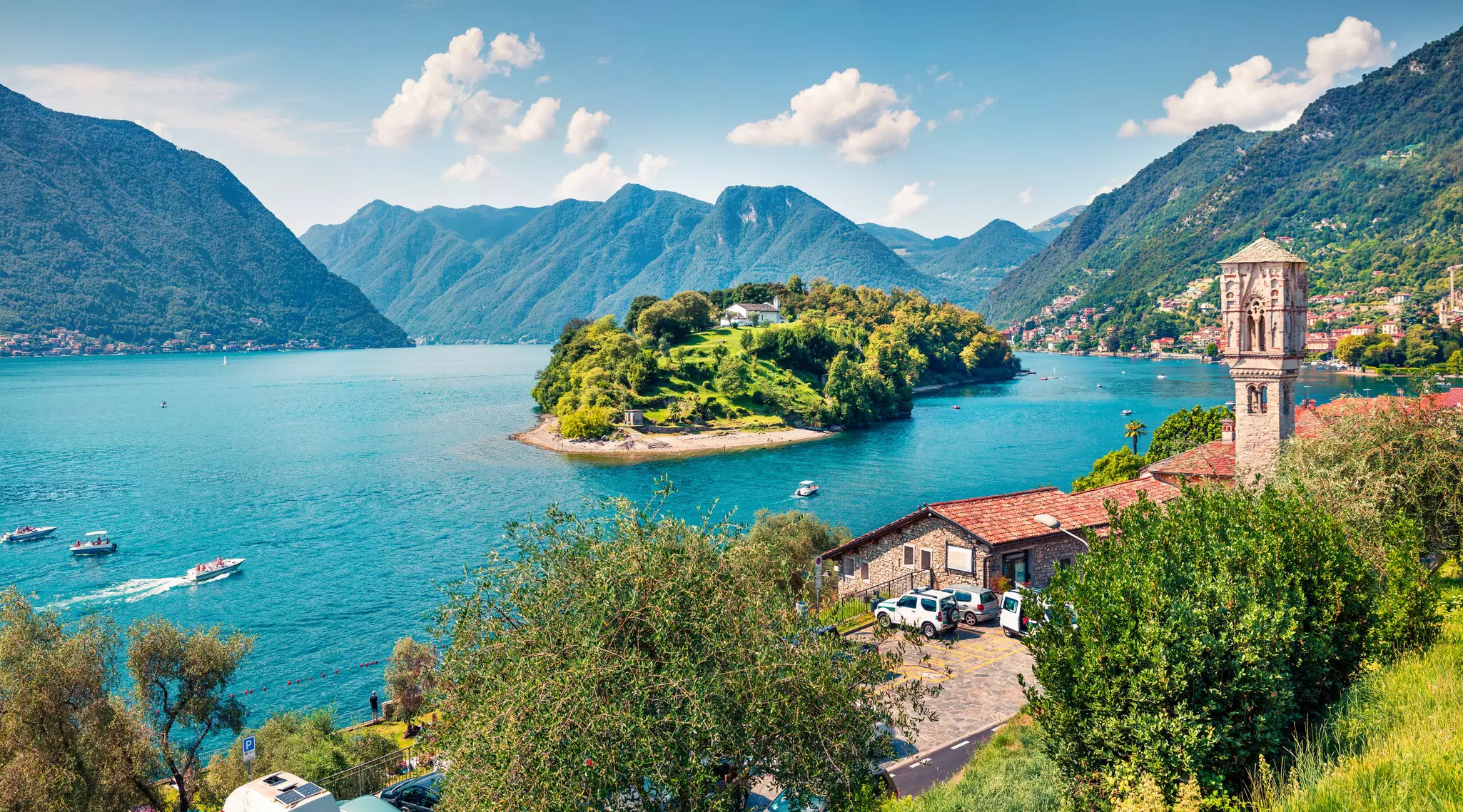 Bright morning view of Isola Comacina from the hiil of Ossuccio village, Lake Como, Italy.