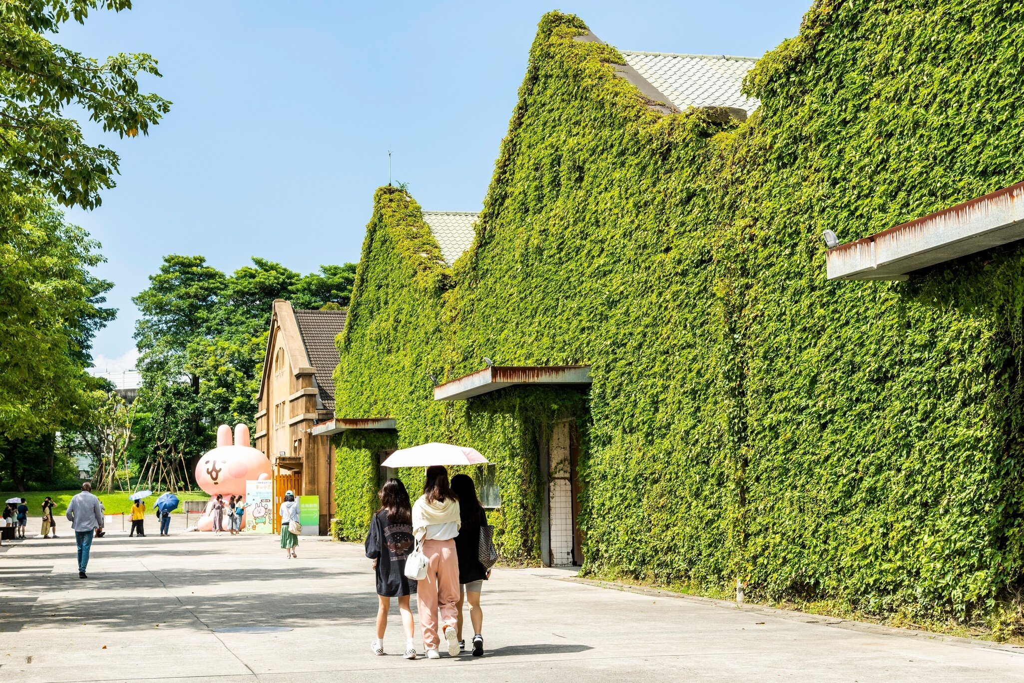 Ivy-covered walls of the exterior of Huashan 1914 Creative Park in Taipei, Taiwan. 