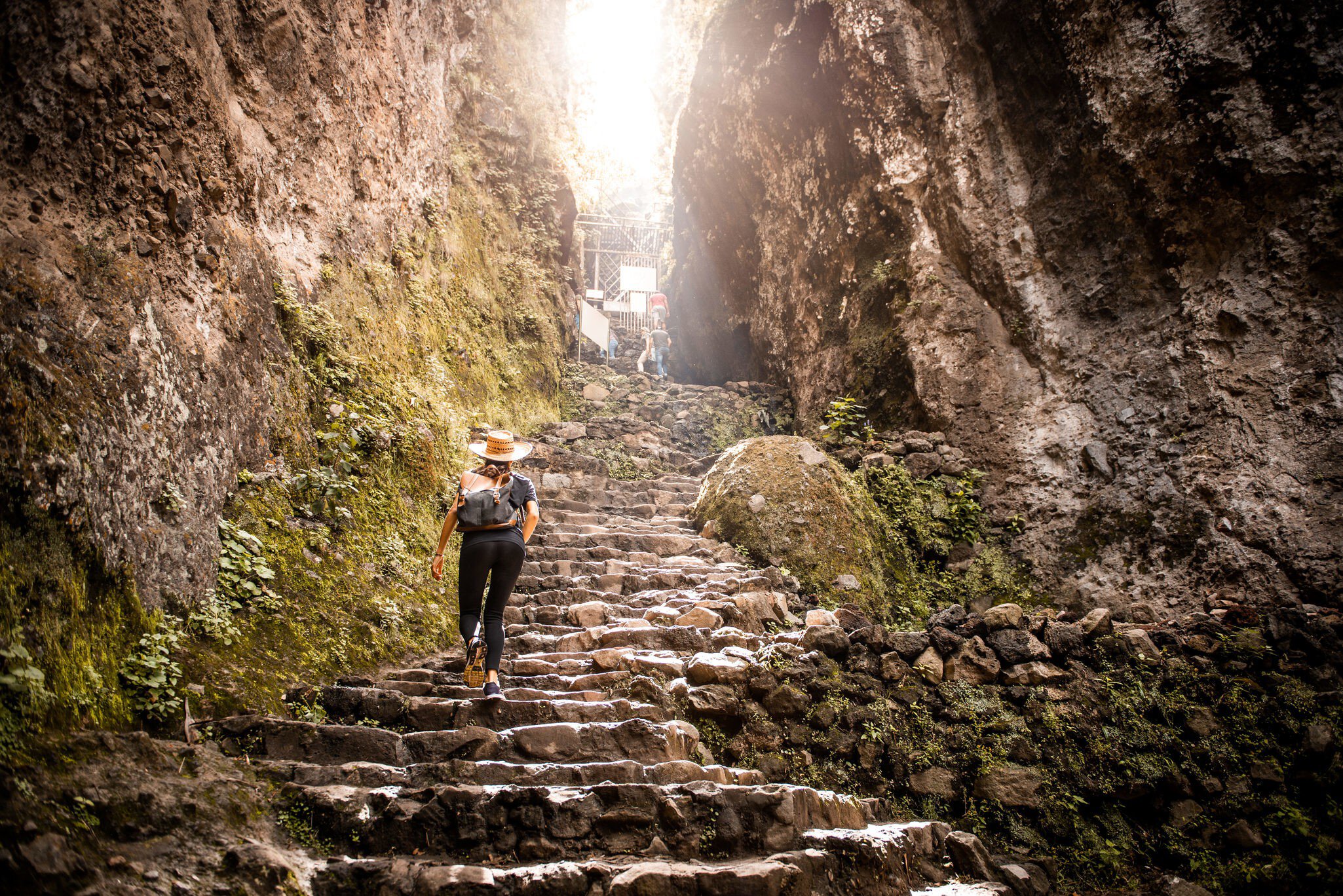 Young Argentinian woman hiking up Tepoztlan mountain, Mexico