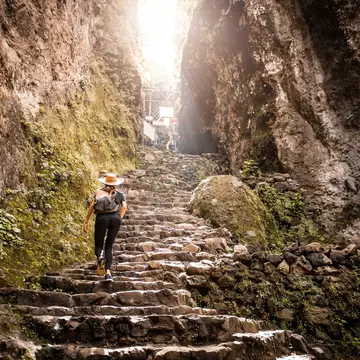 Young Argentinian woman hiking up Tepoztlan mountain, Mexico