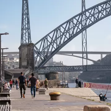 PORTO, PORTUGAL â€“ DEZEMBER, 12 2020: People Walking in "Ribeira" riverside with Iron "Dom LuÃ­s" Bridge - Autumn Day  License Type: media  Download Time: 2021-11-22T08:13:03.000Z  User:   Is Editorial: Yes  purchase_order:   